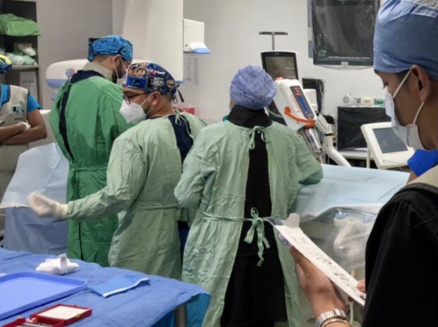 Surgeons operating on a child from Honduras