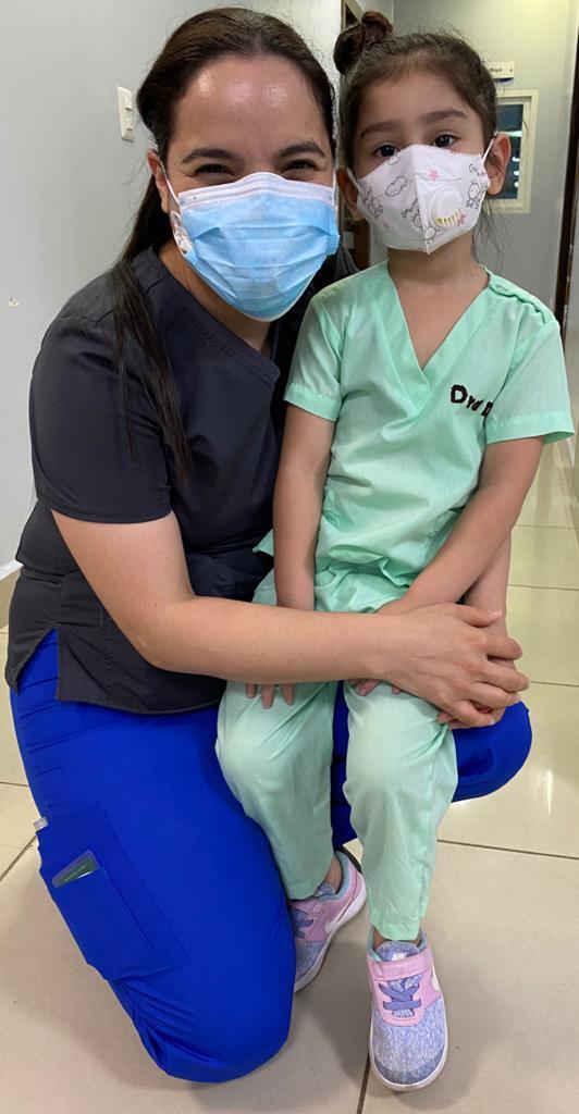 A young patient with her nurse at a hospital