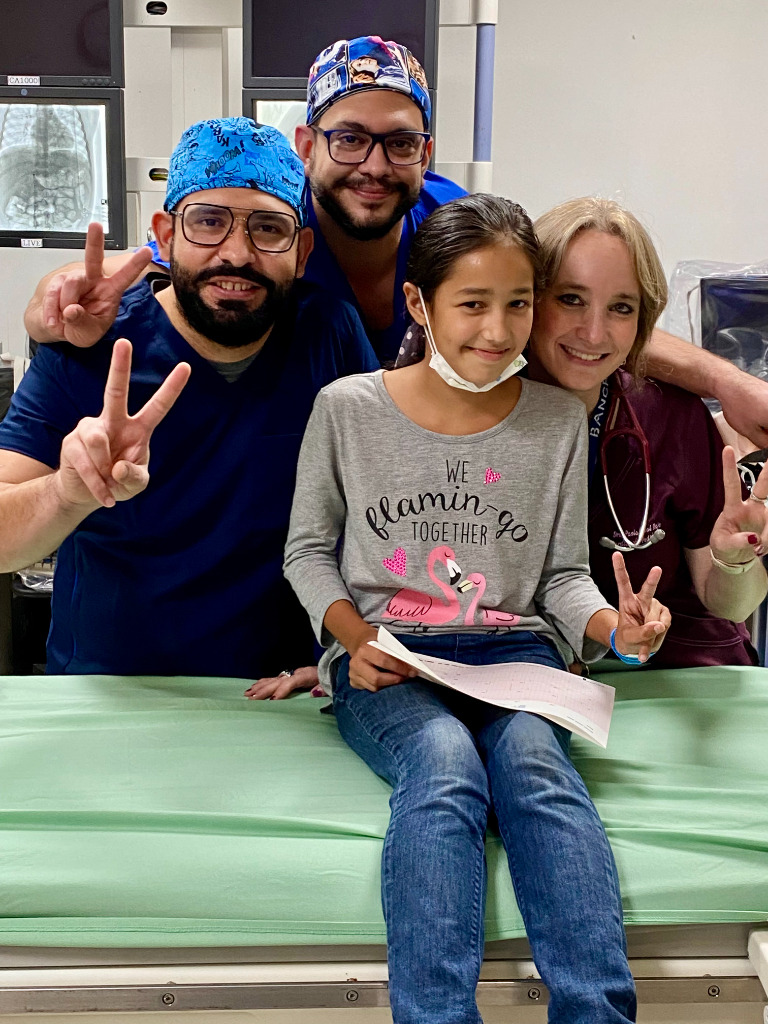 A young patient with her nurses at a hospital
